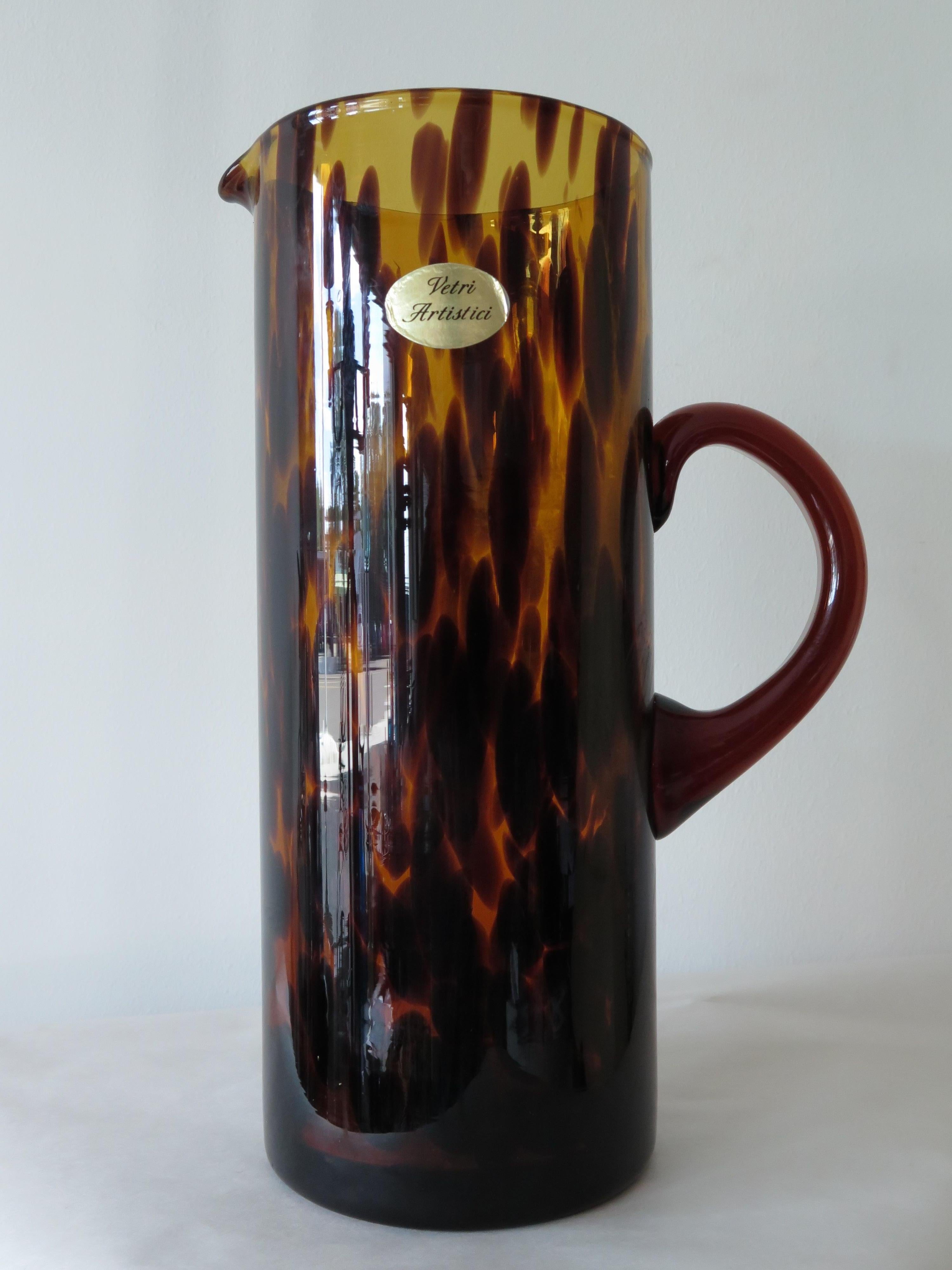 Christian Dior pitcher, made in Italy by Empoli, ca' 1960's. Beautiful and stylish blown glass with tortoise effect. Beware of knock offs-this is the real one-signed twice. Measures: Height is 11