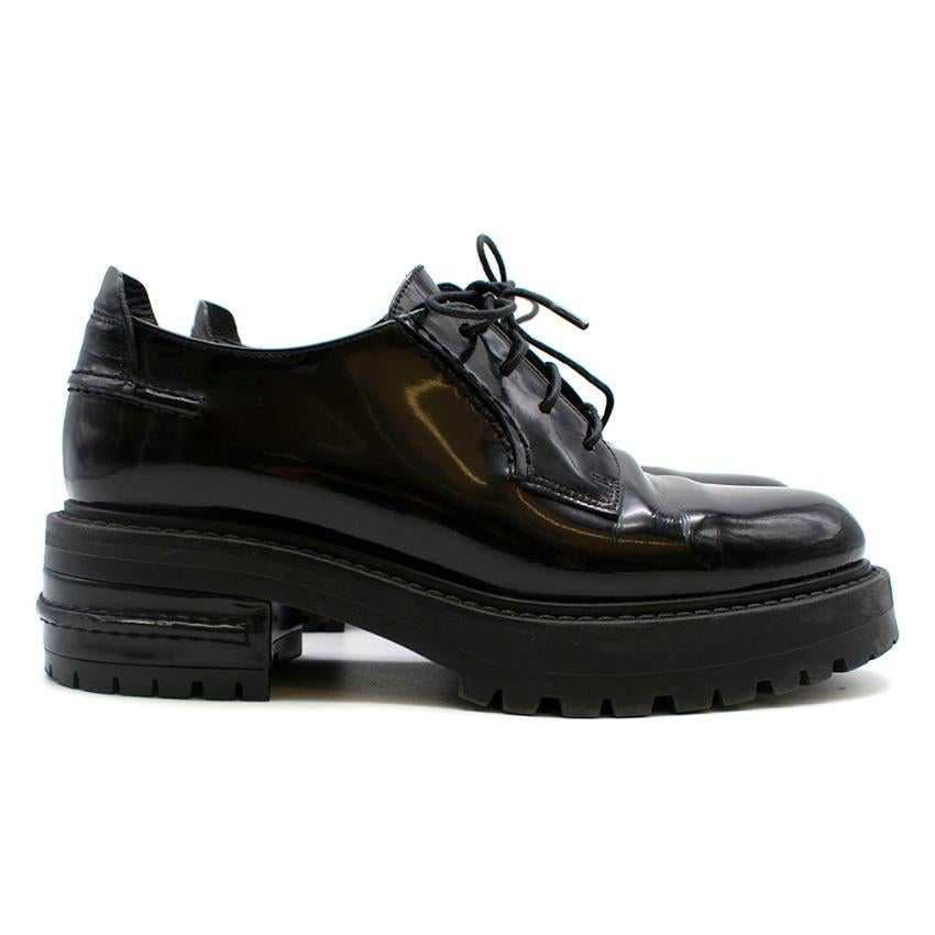 Christian Dior black patent leather lace up chunky brogues. Features Christian Diors signature star sole. 

- Made in Italy
- Rubber soles
- Size 36,5

Please note, these items are pre-owned and may show signs of being stored even when unworn and