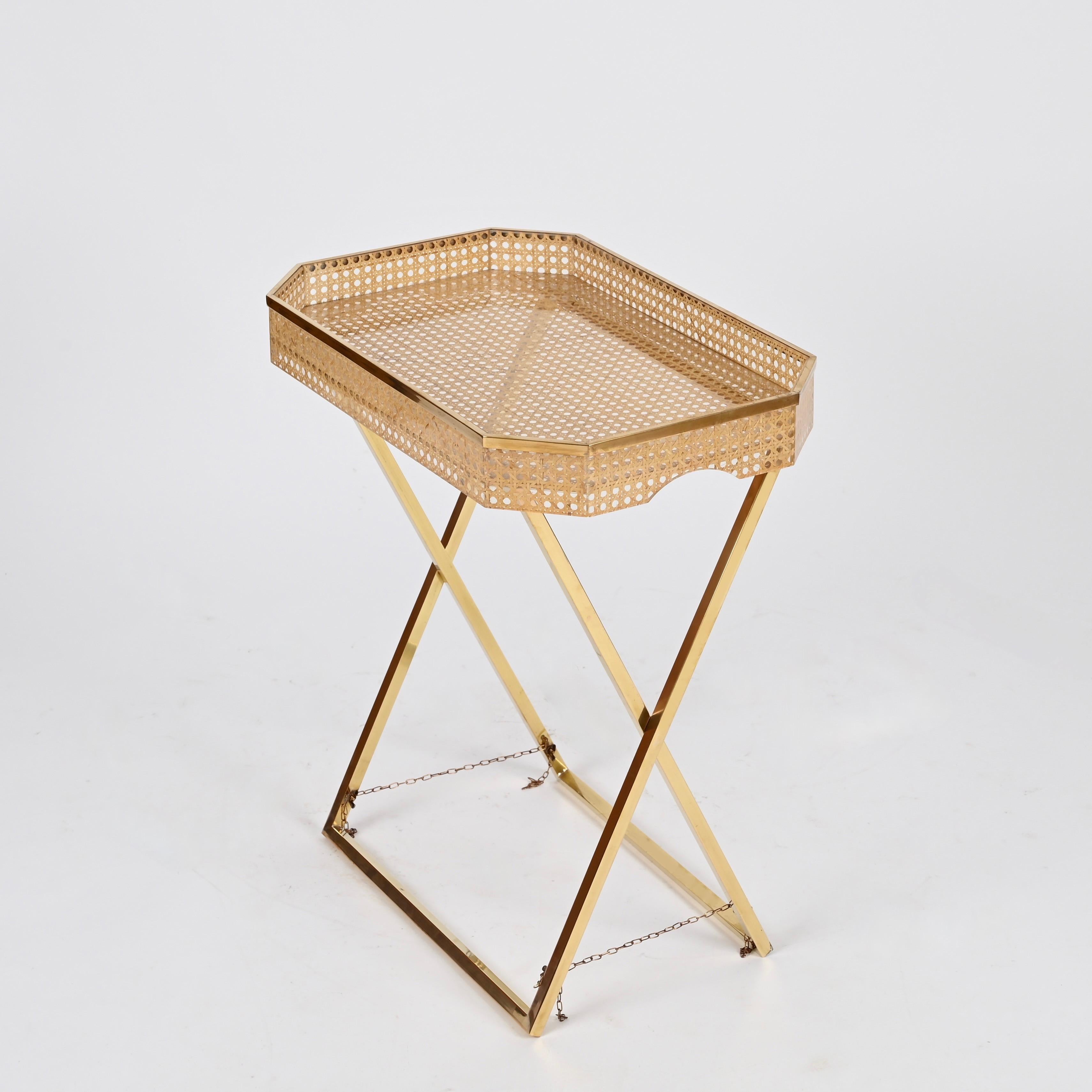 Spectacular tray side table in gold brass, lucite and Vienna straw designed by Christian Dior and produced in Italy during the 1970s.


In spectacular condition, with no chips or cracks. This incredibly stylish and unique side table has a large