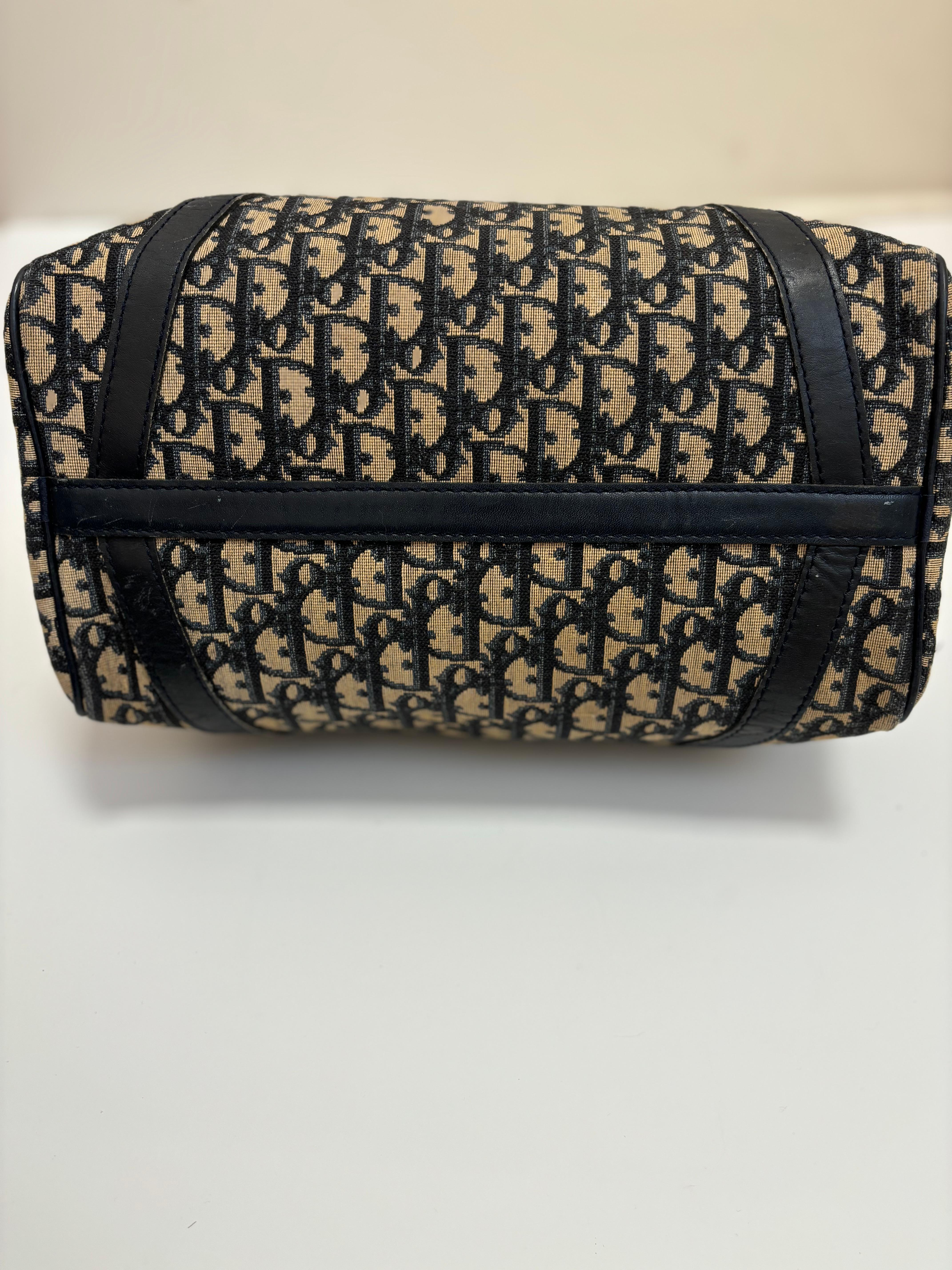 Very well known, this is a trotter pattern Christian Dior Diorissimo Shopper bag.
It is made of canvas with leather trim, and the colors are blue and beige. There is another version in brown and beige, but most people prefer this color