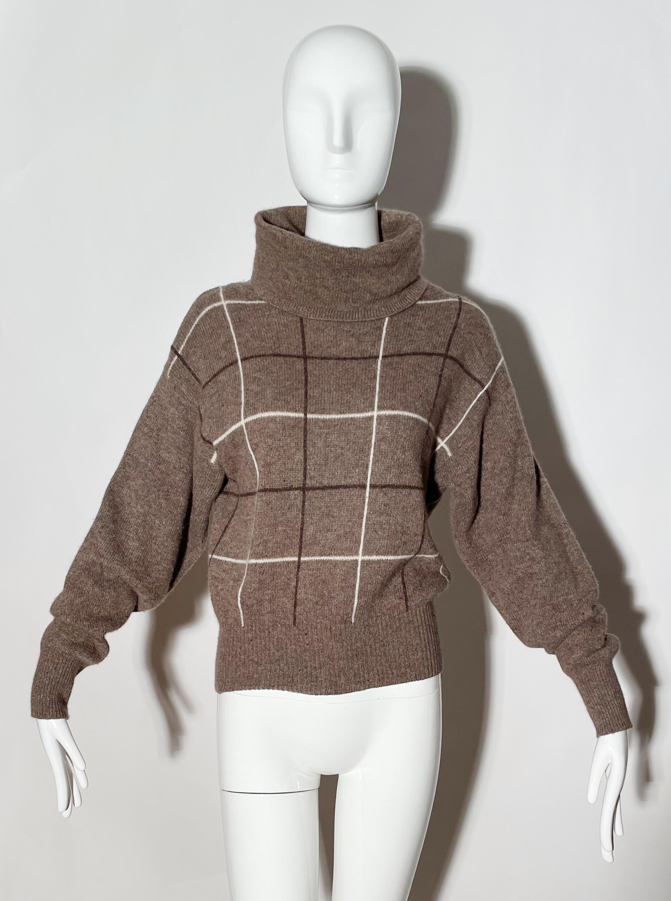 Brown plaid sweater. Turtleneck. Pullover style. Lambswool and angora. Made in Hong Kong. 
*Condition: excellent vintage condition. No visible flaws.

Measurements Taken Laying Flat (inches)—
Shoulder to Shoulder: 21 in.
Bust: 34 in.
Sleeve Length: