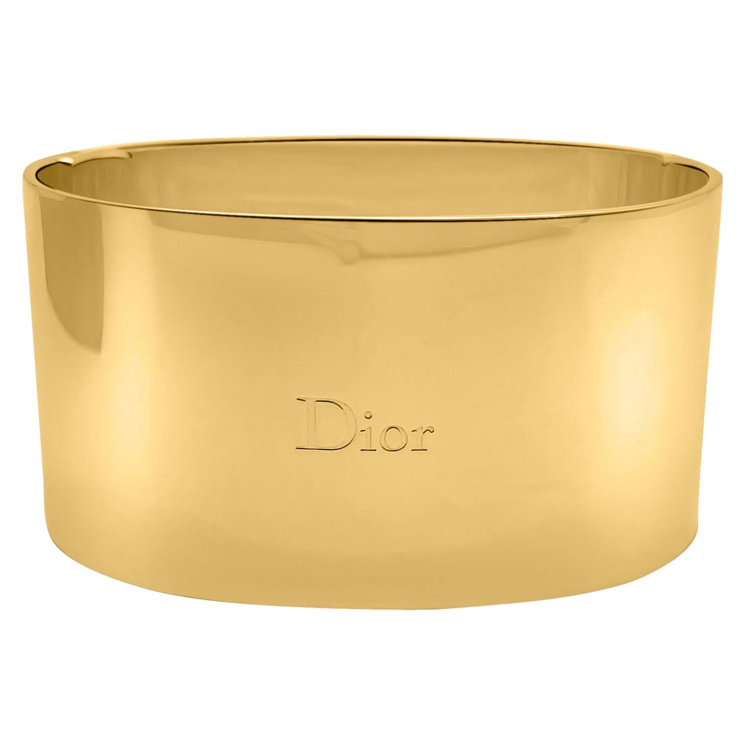 An dramatic and especially striking Vintage Dior Two Tone Blush Cuff. Featuring contrasting highly shine gold plated metal on one side and the most gorgeous blush pink enamel on the other. Embossed Dior on the front and also the inside for extra