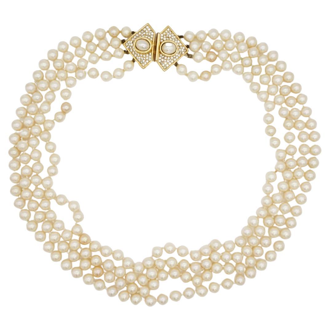 Christian Dior Vintage 1960s Four 4 Strands Layers White Round Pearls Triangle Crystals Pendant Statement Long Necklace, Gold Plated

Very good condition. Light scratches or colour loss, barely noticeable, 100% Genuine. Rare to find.

1960s