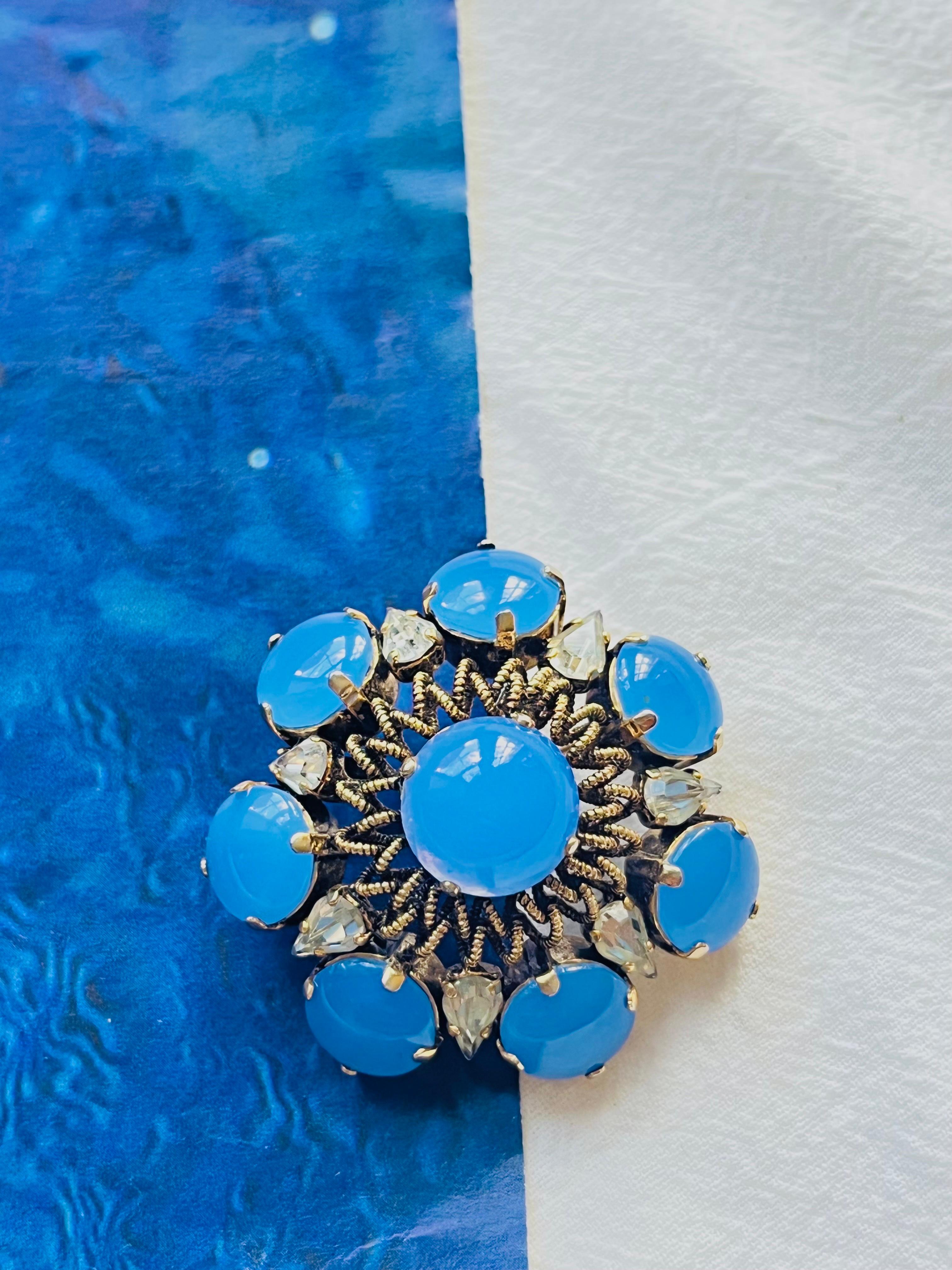 Christian Dior Vintage 1964 Sapphire Milky Blue Cabochon Wreath Flower Water Drop Crystals Openwork Exquisite Brooch, Gold Plated

Very good condition. 100% genuine. Rare to find. 

A unique piece. This is gold plated stylised brooch. Signed 