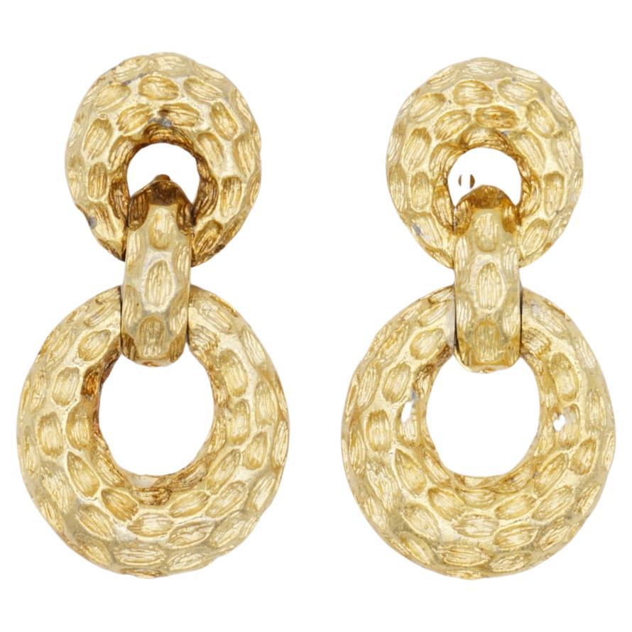 Christian Dior Vintage 1970 Textured Circle Oval Hoop Drop Chunky Clip Earrings, Gold Plated

Very good condition. Very light scratches, very colour loss, barely noticeable. 100% Genuine.

One earrings signed 
