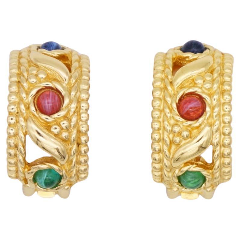 Christian Dior Vintage 1970s Baroque Gripoix Emerald Sapphire Ruby Dome Half Hoop Openwork Exquisite Clip Earrings, Gold Tone

Very excellent condition. Vintage and rare to find. 100% Genuine.

A very beautiful pair of clip on earrings by Chr. DIOR,
