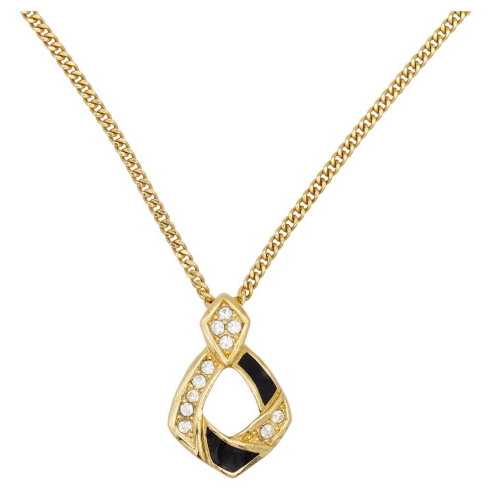 Christian Dior Vintage 1980 Black Enamel Crystals Double Diamond Style Swirl Openwork Pendant Necklace, Gold Tone

Very excellent condition. 100% genuine. 

Renowned for its timeless elegant designs, Christian Dior presents this necklace. Crafted