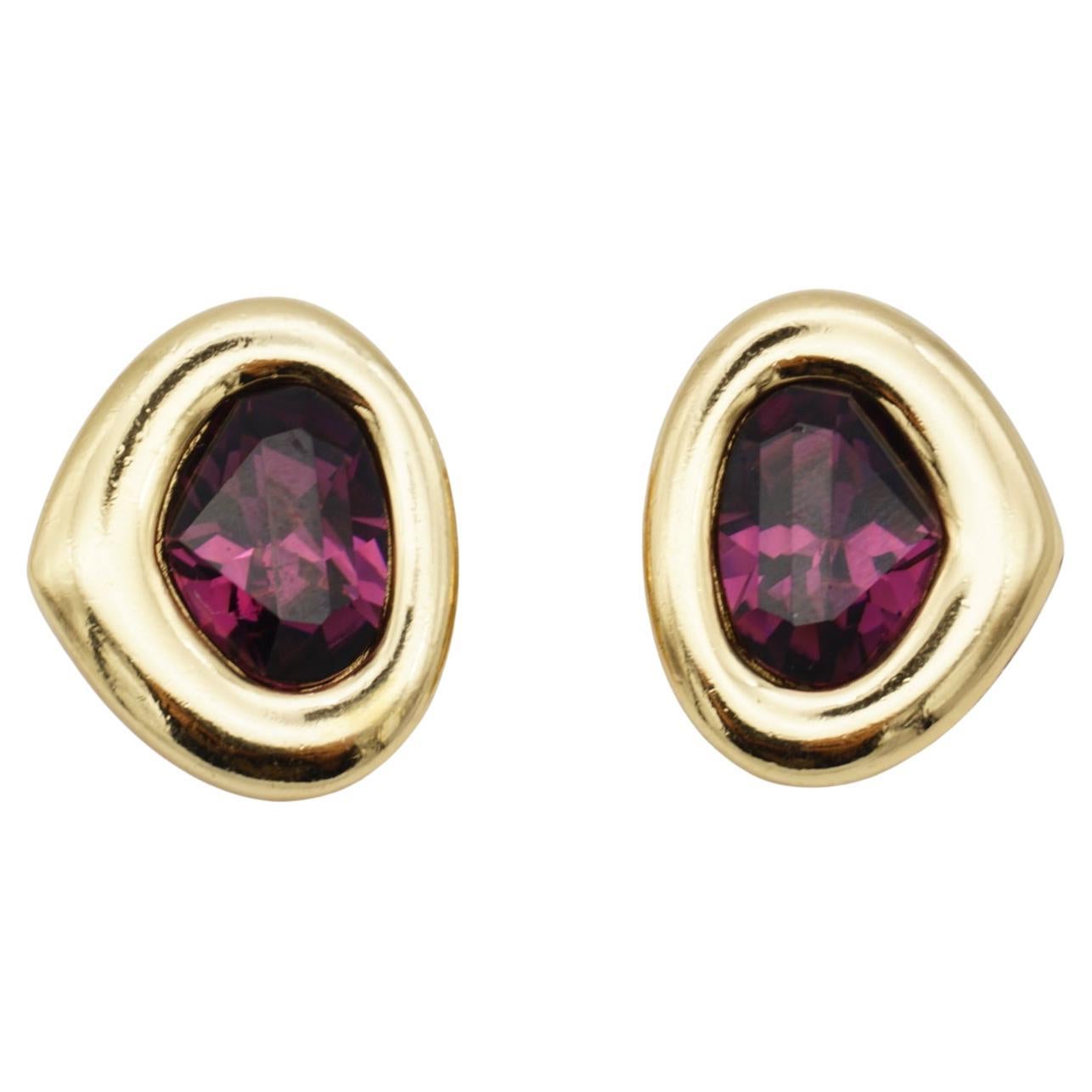 Christian Dior Vintage 1980s Amethyst Crystal Heart Triangle Oval Clip Earrings, Gold Tone.

Very good condition. Light scratches or colour loss, barely noticeable. 100% Genuine

A very beautiful pair of clip on earrings by Chr. DIOR, signed at the