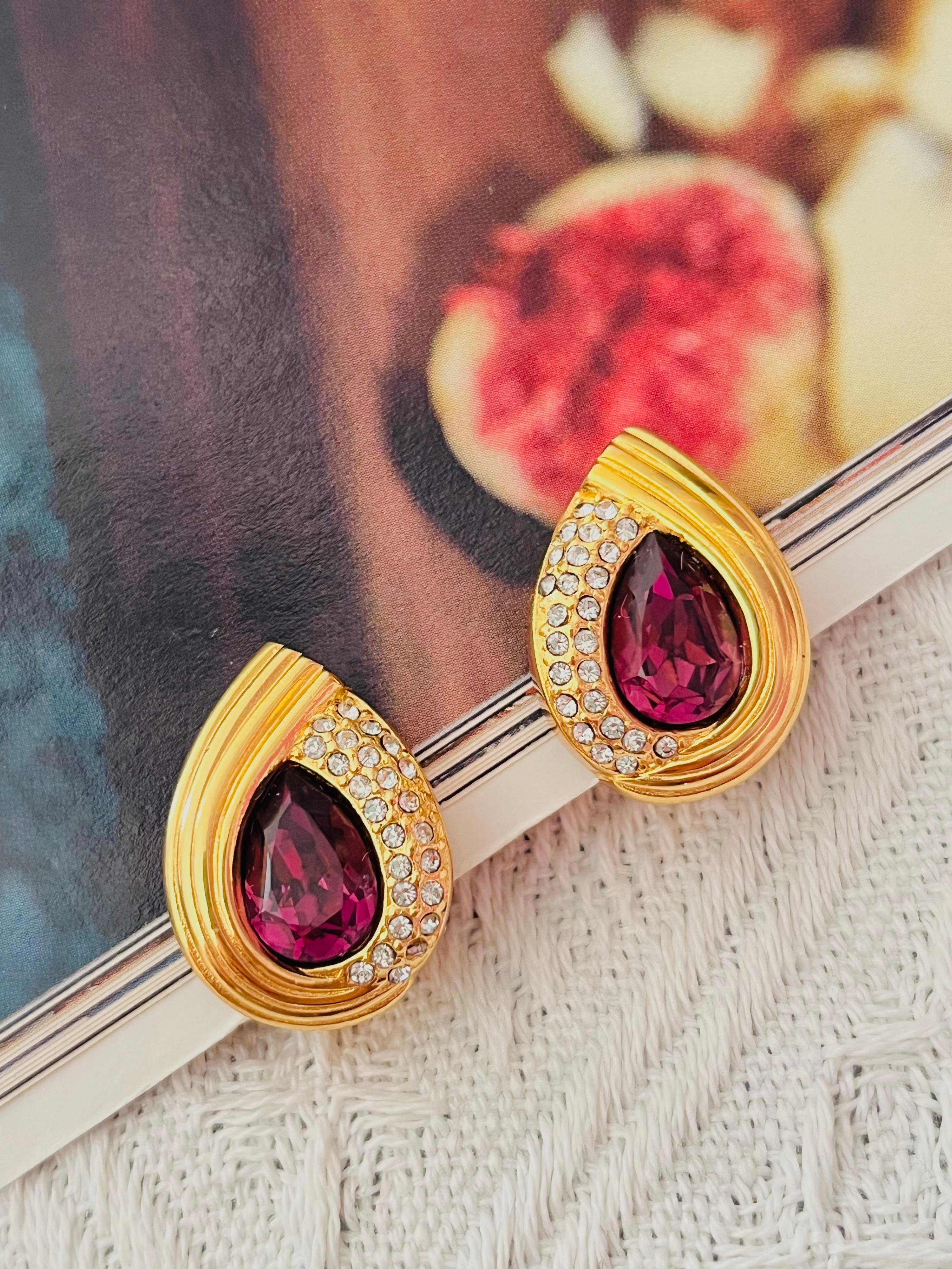 Christian Dior Vintage 1980s Asymmetric Amethyst Purple Crystals Tear Water Drop Clip Earrings, Gold Tone

Good condition. Some light scratches, barely noticeable. Some spots at back. 100% Genuine

A very beautiful pair of clip on earrings by Chr.