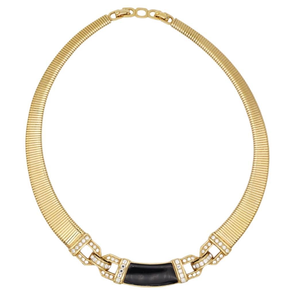 Christian Dior Vintage 1980s Unisex Black Enamel Crystals Interlocked Ribbed Omega Choker Necklace, Gold Tone

Very excellent condition. 100% genuine. A unique piece. Signed at the back. 

Size: 30 cm. Extend chain: 2 cm. Pendant: 8.2*1.2