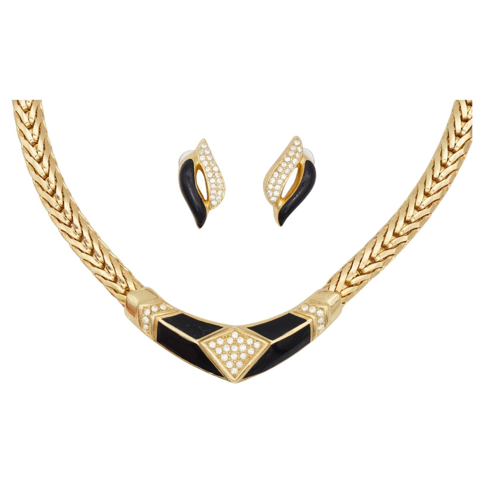 Christian Dior Vintage 1980s Black Moon Leaf Openwork Diamond Crystals Set Chunky Braided Choker Necklace Pierced Earrings, Gold Tone

Very excellent condition. 100% Genuine. Sign at clasp of necklace and back earrings. Vintage and rare to