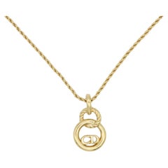 Christian Dior, collier pendentif vintage ajouré avec logo CD et monogramme, années 1980