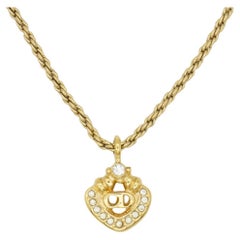 Christian Dior, collier pendentif vintage ajouré avec logo CD et monogrammes, années 1980