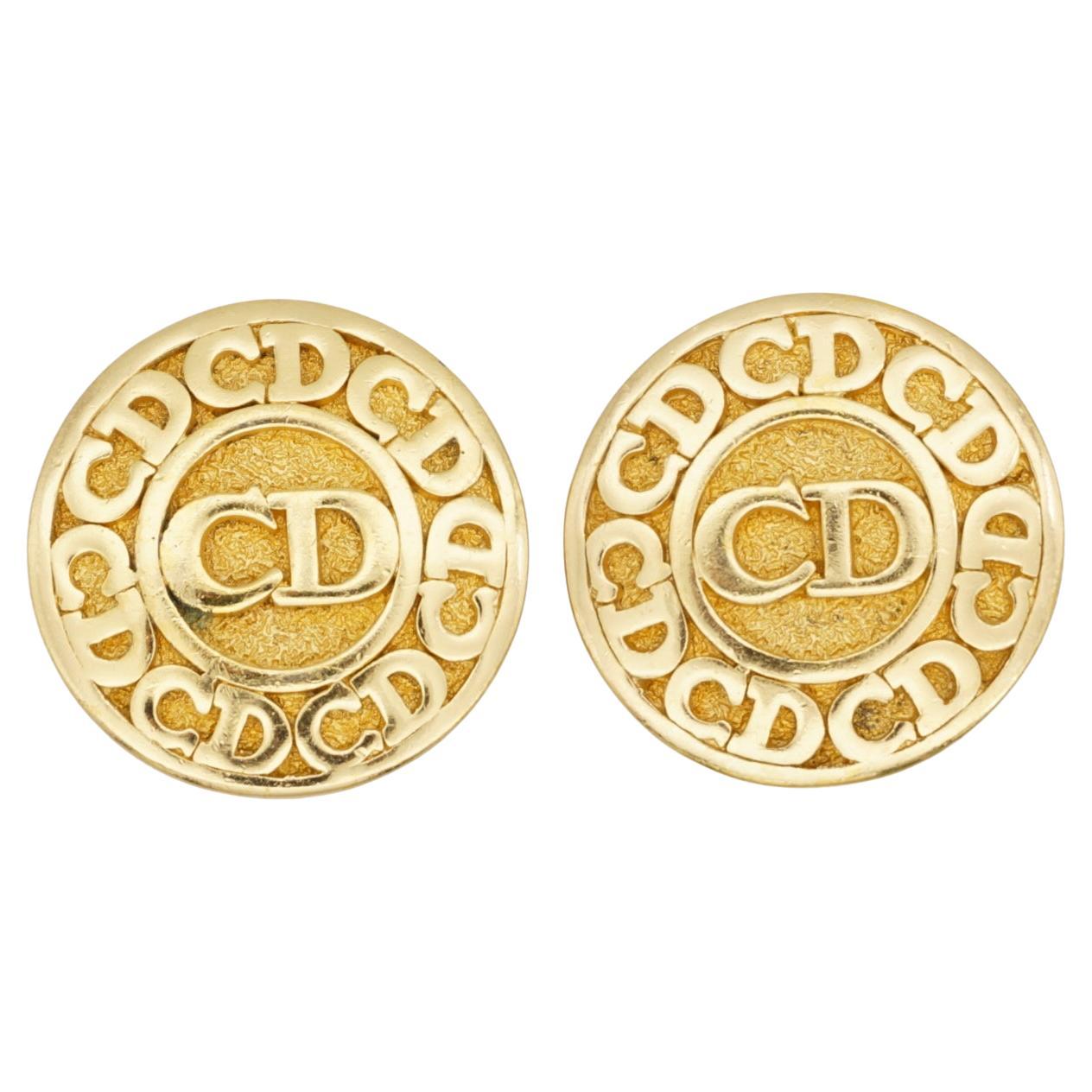 Christian Dior Vintage 1980s Classic Logo CD Button Round Circle Clip Earrings, Gold Plated

Very excellent condition. Only some dark spots at back, barely noticeable. 100% Genuine.

A very beautiful pair of earrings by Chr. DIOR, signed at the