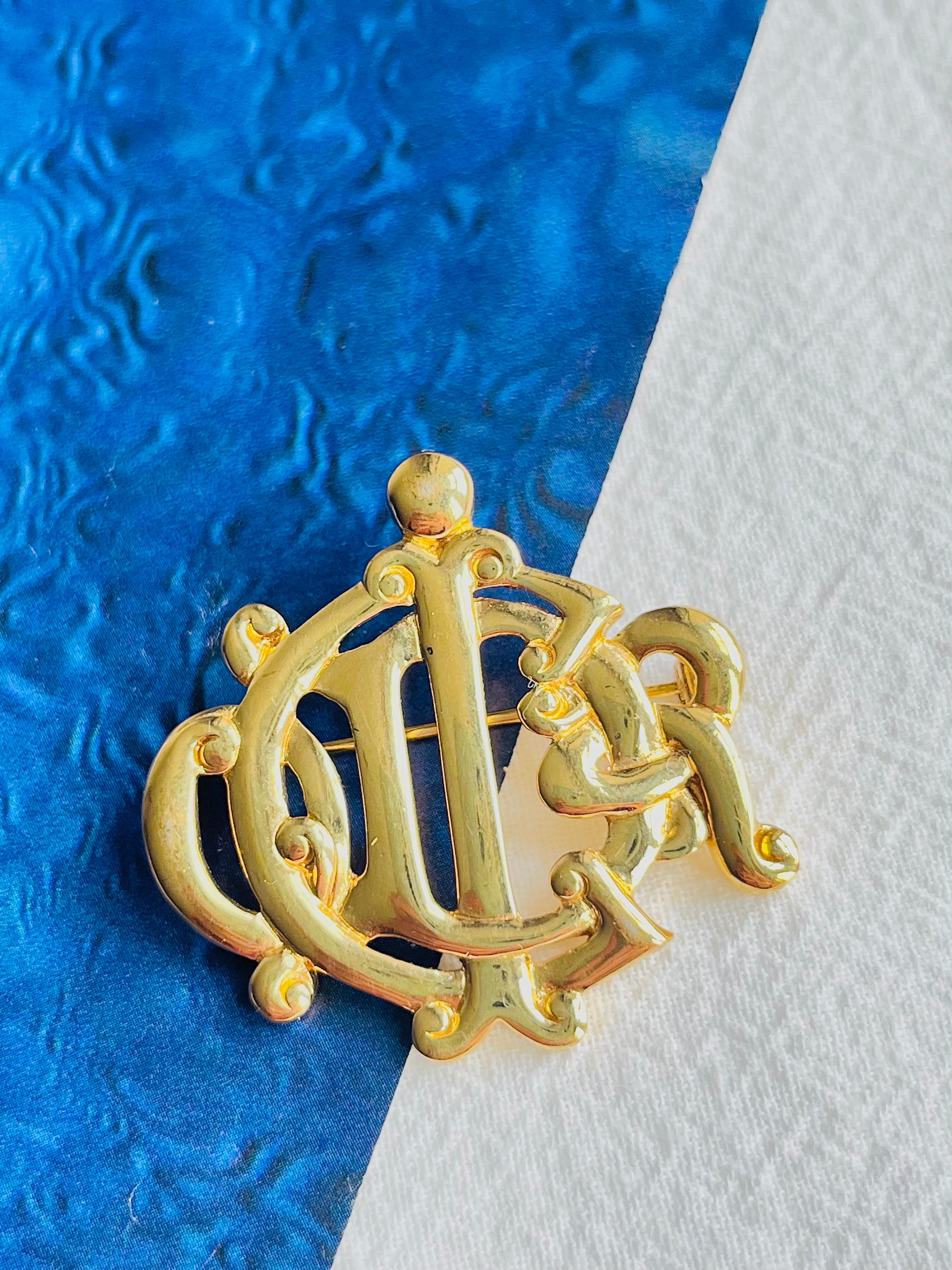 Women's or Men's Christian Dior Vintage 1980s Glow Logo Monogram interlocked Letters Gold Brooch For Sale