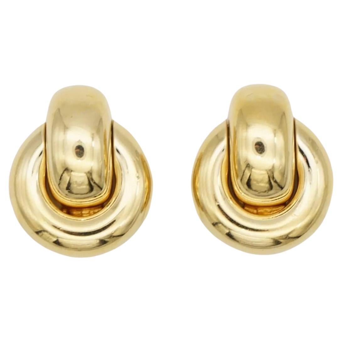Christian Dior Vintage 1980s Interlocked Glow Circle Knot Hoop Loop Chunky Clip Earrings, Gold Tone

Very good condition. 100% Genuine.

A very beautiful pair of earrings by Chr. DIOR, signed at the back.

Material: Gold plated metal.

Size: 2.7*2.2