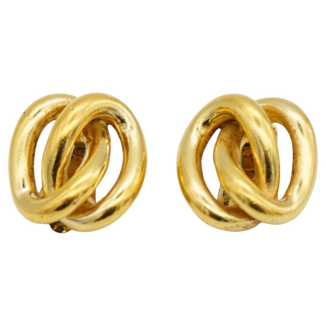 Christian Dior Vintage 1980s Interlocked Double Knot Twist Rope Hoop Chunky Elegant Modernist Clip Earrings, Gold Tone

Good condition. Only colour loss at back, still very good to use. So price is dropped a lot. Very good value. 100% Genuine.

A