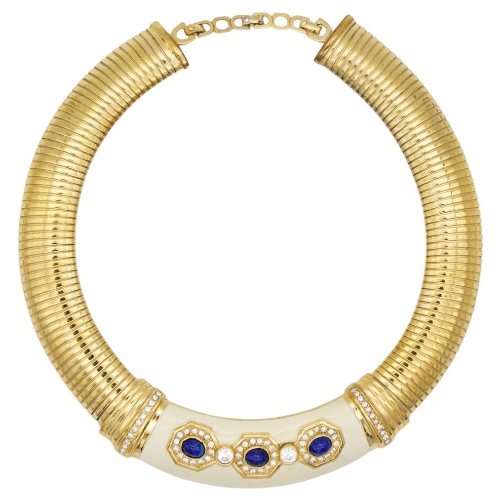 Christian Dior Vintage 1980s Lapis Navy Stones Cabochon Crystals Beige Extra Wide Ribbed Adjustable Omega Chunky Choker Collar Necklace, Gold Plated

Very good condition. 100% Genuine. 

Marked 'Chr.Dior (C) '. Rare to find.

Materials: Gold Plated