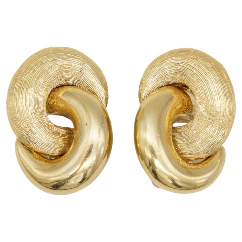 Christian Dior Vintage 1980s Large Interlock Knot Matte Glow Gold Clip Earrings For Sale