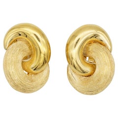 Christian Dior Vintage 1980s Large Interlock Knot Matte Glow Gold Clip Earrings Christian Dior Vintage 1980s Large Interlock Knot Matte Glow Gold Clip Earrings