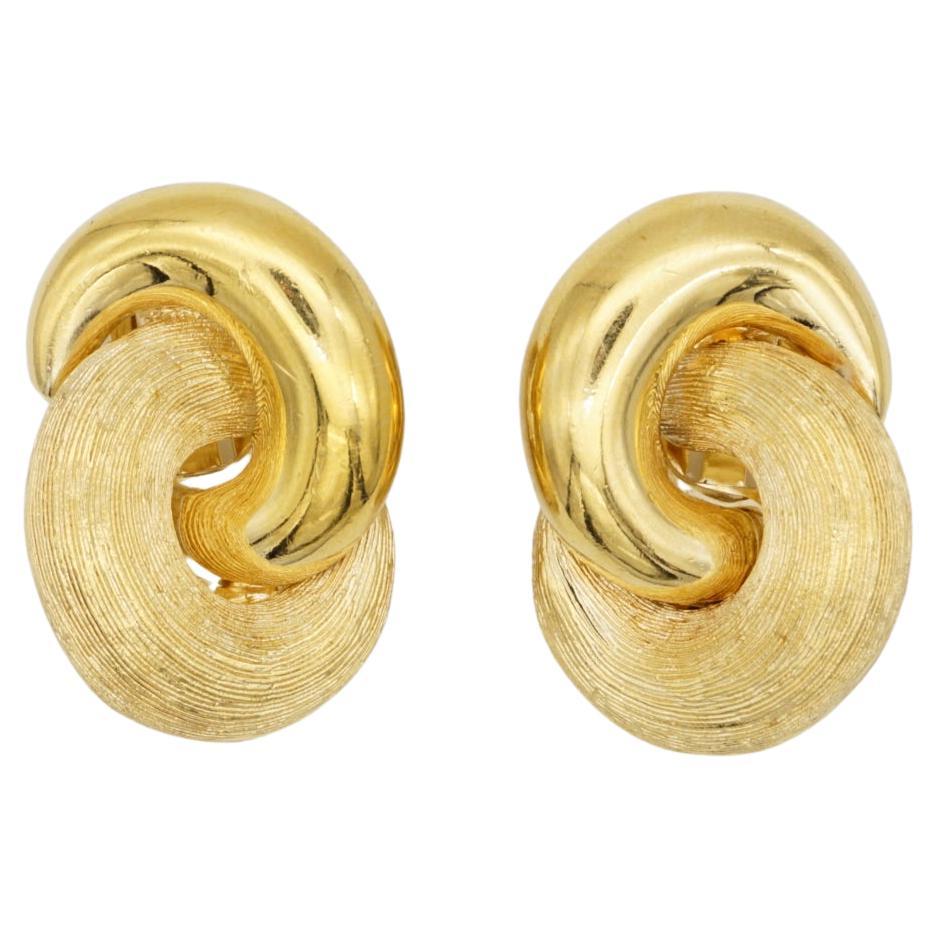 Christian Dior Vintage 1980s Large Interlock Knot Matte Glow Gold Clip Earrings