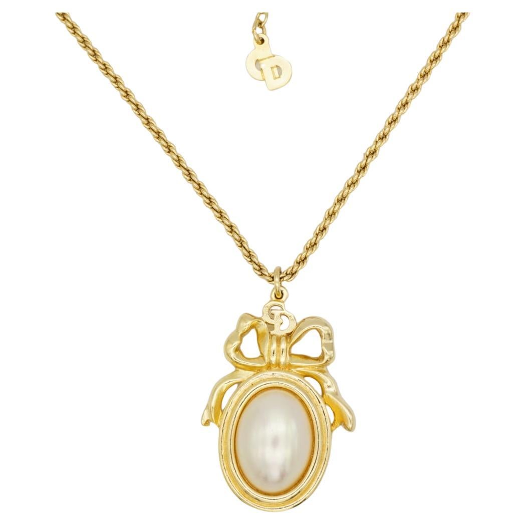 Christian Dior Vintage 1980s Large Logo CD Bow Ribbon Oval White Pearl Necklace For Sale