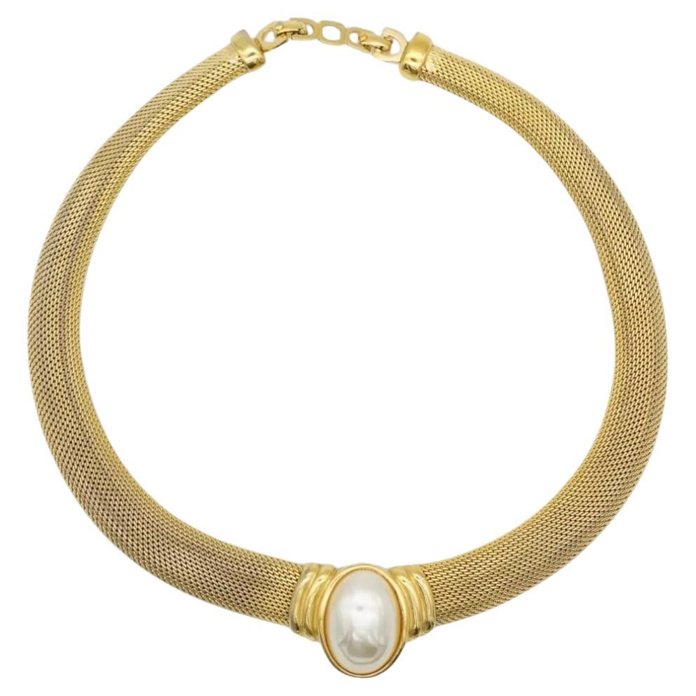 Christian Dior Vintage 1980s Unisex Large Oval White Pearl Pendant Mesh Snake Omega Chunky Statement Necklace, Gold Plated

Very good condition. Some light scratches or colour loss, barely noticeable.

Marked 'Chr.Dior (C) '. 100%
