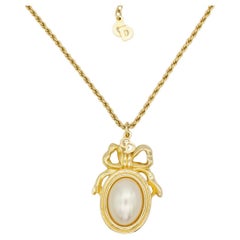 Christian Dior Vintage 1980s Large White Pearl Logo CD Bow Ribbon Oval Necklace
