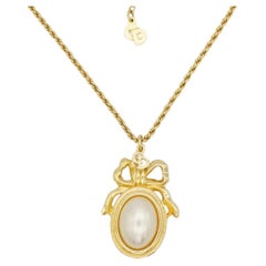 Christian Dior Vintage 1980s Large White Pearl Logo CD Bow Ribbon Oval Necklace