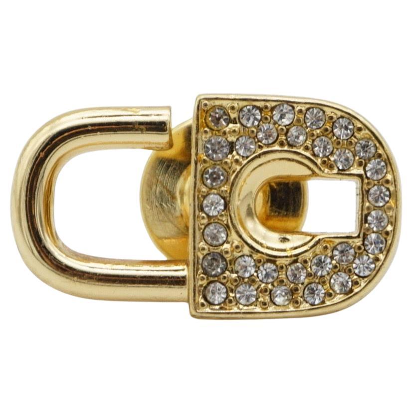 Christian Dior Vintage 1980s Logo CD Crystals Padlock Key Retro Pin Brooch, Gold Tone

Very good condition. Very light scratches, barely noticeable. 100% genuine.

A unique piece. This is gold plated stylised brooch. Safety-catch pin closure.

Size: