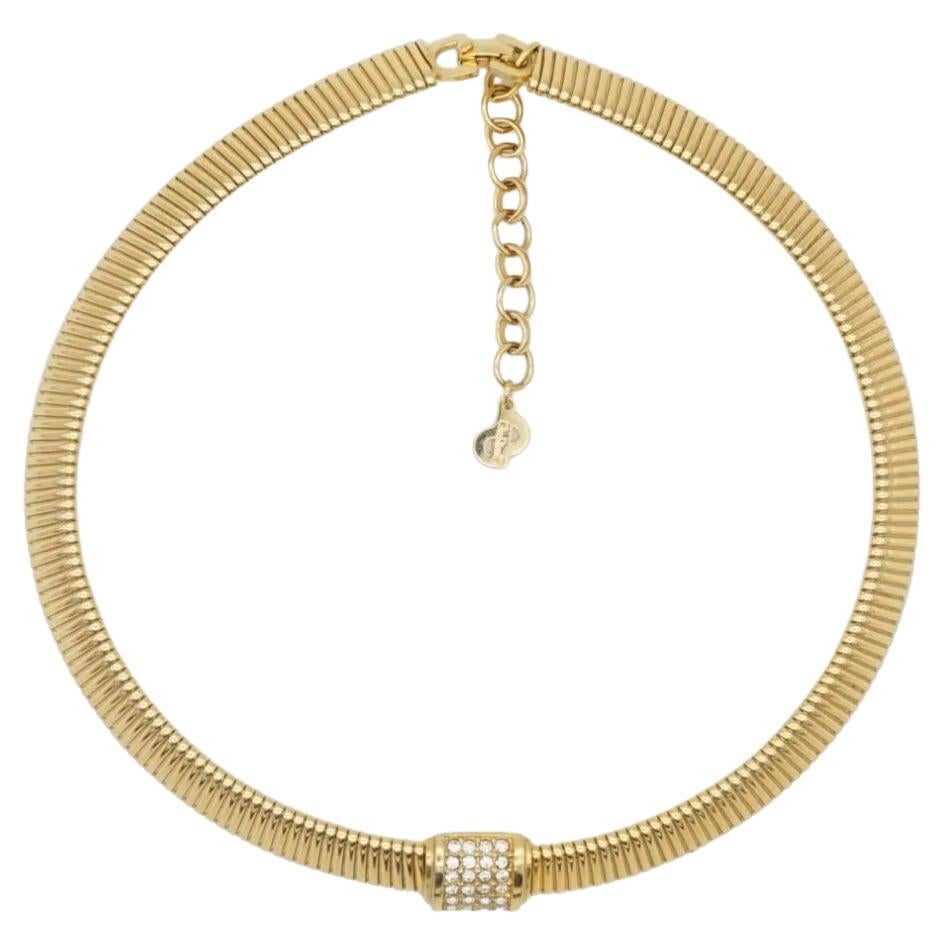 Christian Dior Vintage 1980s Omega Collar Shining Crystals Square Necklace, Gold Plated

Very excellent condition. Without damage or noteworthy wear. Marked 'Chr.Dior (C) '. 100% Genuine.

This pieces dates to the 1980s and features a broad timeless