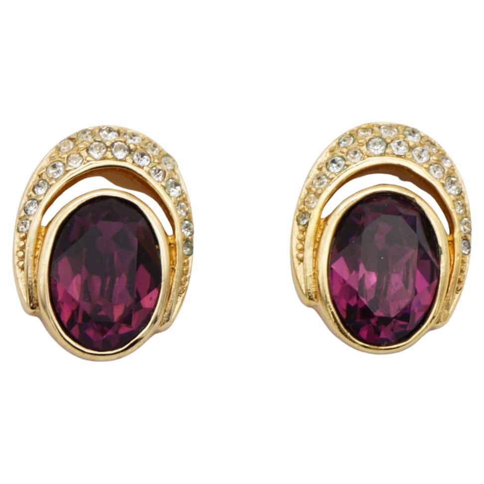 Christian Dior Vintage 1980s Oval Crystals Amethyst Purple Openwork Pierced Earrings, Gold Tone

Very good condition. Light scratches or colour loss, barely noticeable. Not original ears blocks. 100% Genuine.

A very beautiful pair of clip on