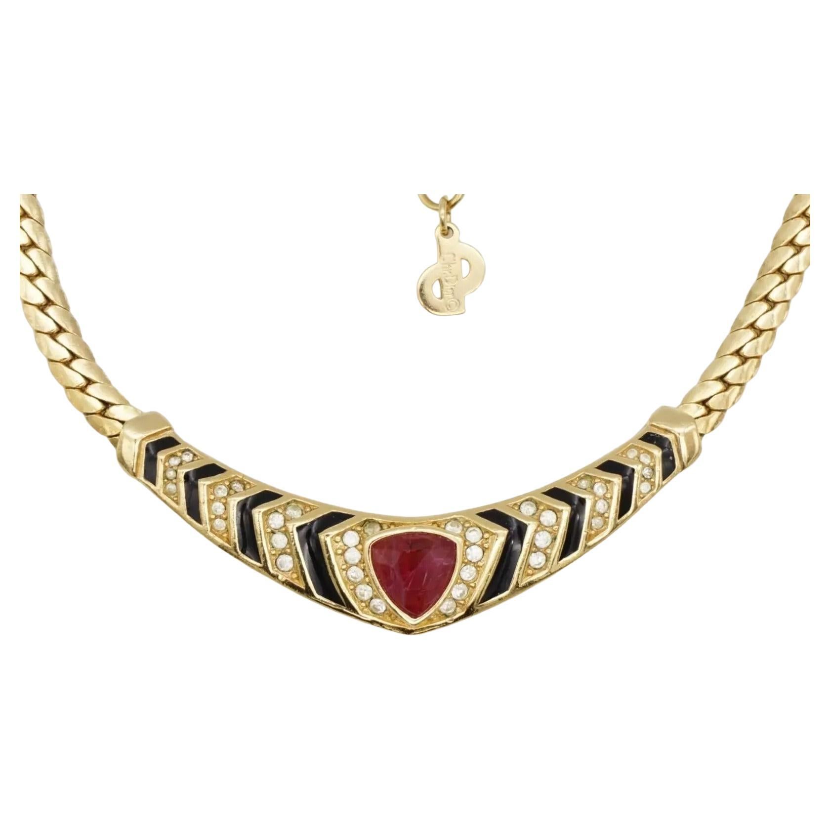 Christian Dior Vintage 1980s Ruby Red Black Enamel Crystals Triangle Pendant Elegant Monderist Necklace, Gold Plated

Very excellent condition. Marked 'Chr.Dior (C) '. 100% Genuine. 

Material: Gold plated metal, Rhinestones, Enamel.

Length: 32 cm.