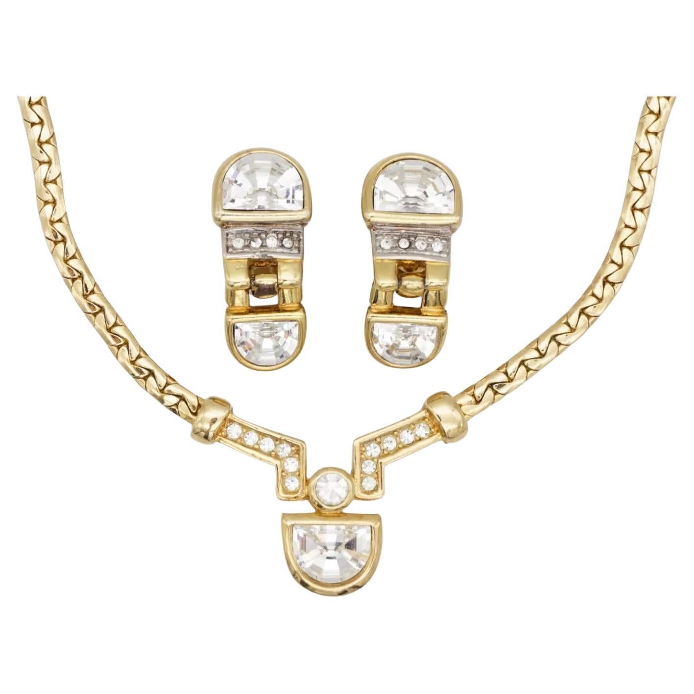Christian Dior Vintage 1980s Semicircle Shining Crystals Pendant Set Necklace Earrings, Gold Tone

Very good condition. Some of light scratches or colour loss, barely noticeable.

Vintage and rare to find. 100% Genuine. 

Sign at clasp of necklace.