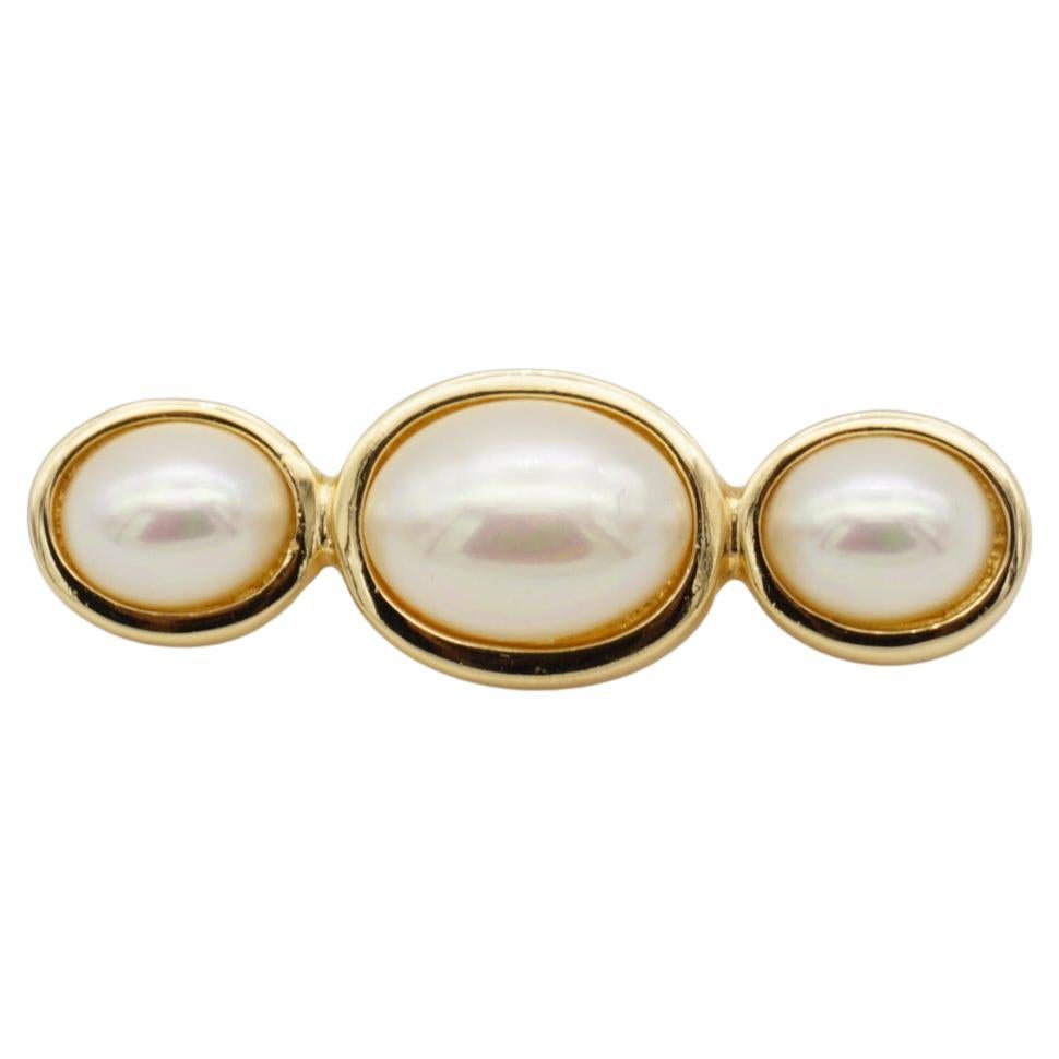 Christian Dior Vintage 1980s Symmetric White Trio Oval Pearls Long Bar Brooch, Gold Plated

Very excellent condition. Very new. 100% Genuine.

A unique piece. This gold plated stylised brooch with three gorgeous faux pearls. 

Safety-catch pin