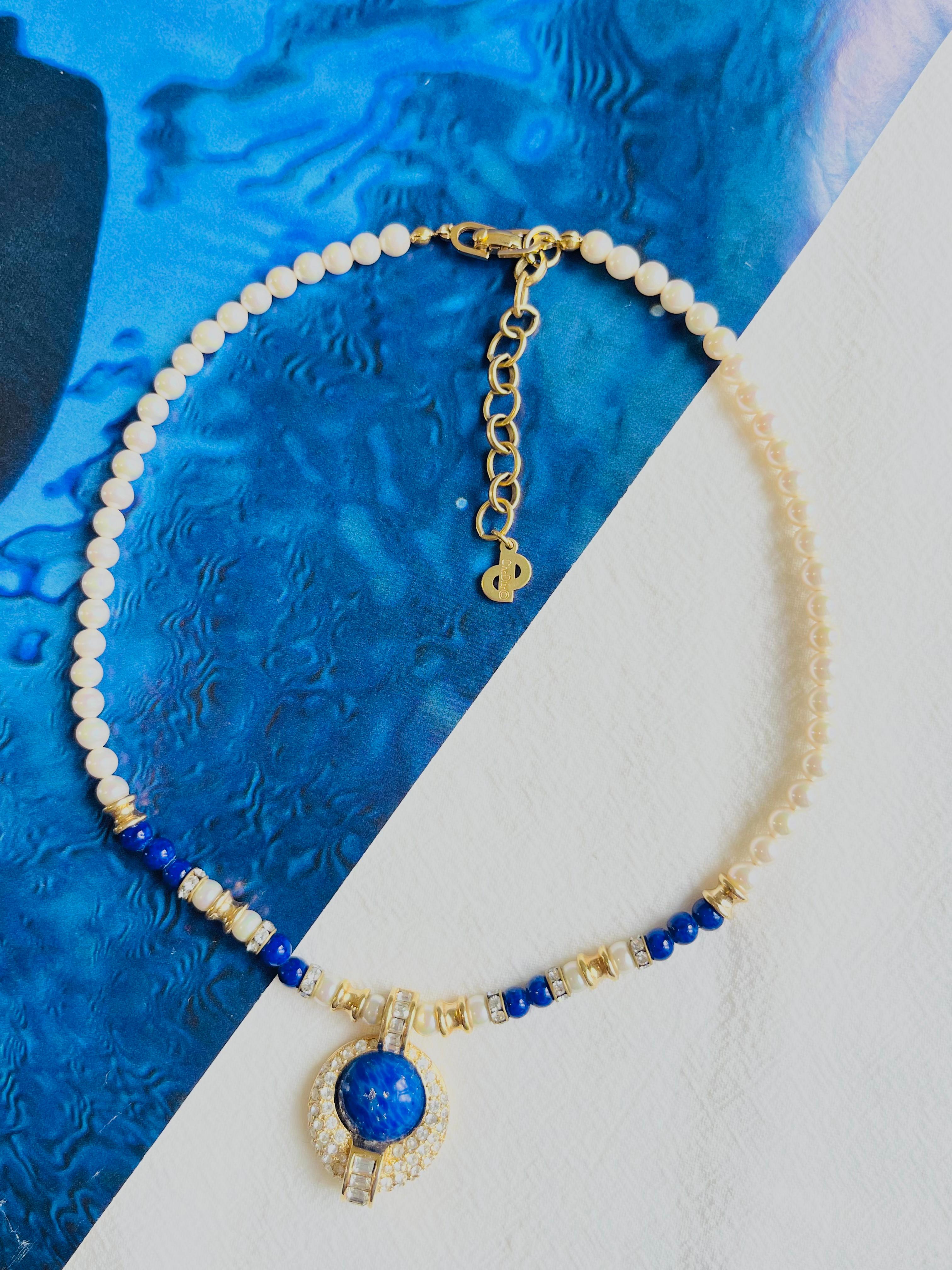 Christian Dior Vintage 1980s White Pearls Lapis Cabochon Sparkling Crystals Oval Round Pendant Necklace, Gold Plated

Very excellent condition. 100% Genuine.

Marked 'Chr.Dior (C) '. Rare to find.

Materials: Gold Plated metal, rhinestones, Faux