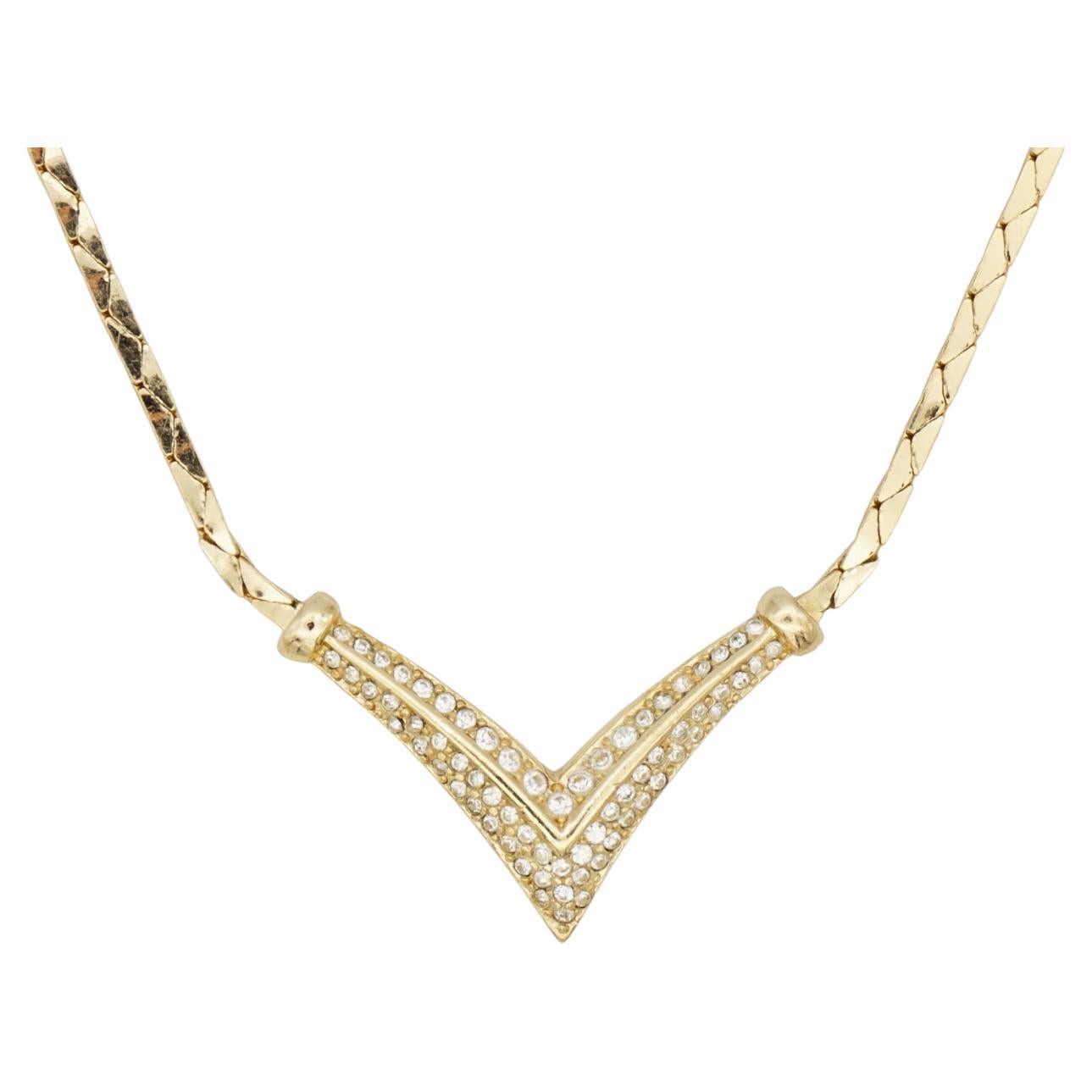 Christian Dior Vintage 1980s Whole Crystal Triangle Arrow Pendant Choker Necklace, Gold Tone

Very good condition. 100% Genuine. Rare to find.

This is a very stylish and rare piece of jewellery. Signed at the back. Marked 'Chr.Dior (C) '.