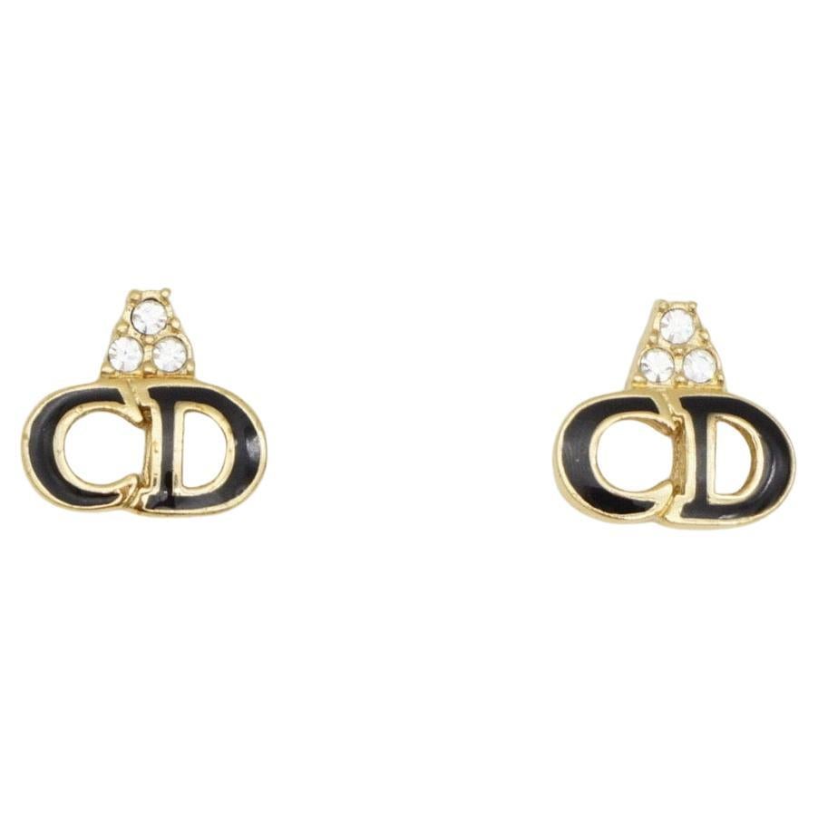 Christian Dior Vintage 1990s Black Enamel Logo CD Monogram Trio Cluster Crystals Pierced Earrings, Gold Plated

Very good condition. 100% Genuine.

A very beautiful pair of earrings by DIOR, signed at the back. Rare to find.

Size: 1.3*1.2