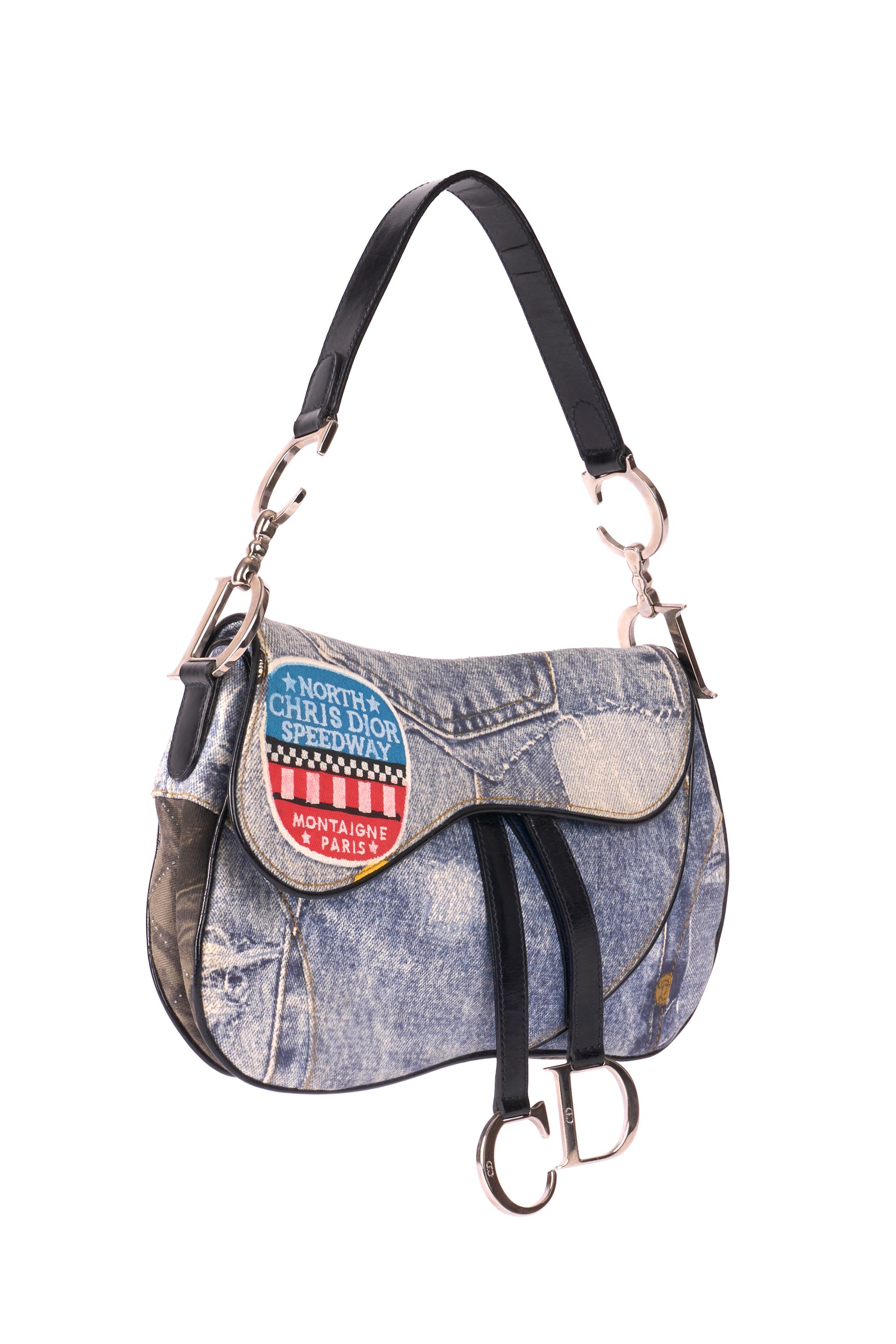 Christian Dior by John Galliano 2001 double speedway saddle bag. Features ‘CD’ signature on both sides of the strap and at the front, denim print, velcro closure and one interior pocket. In excellent vintage condition. 

Brand: Christian Dior
Color: