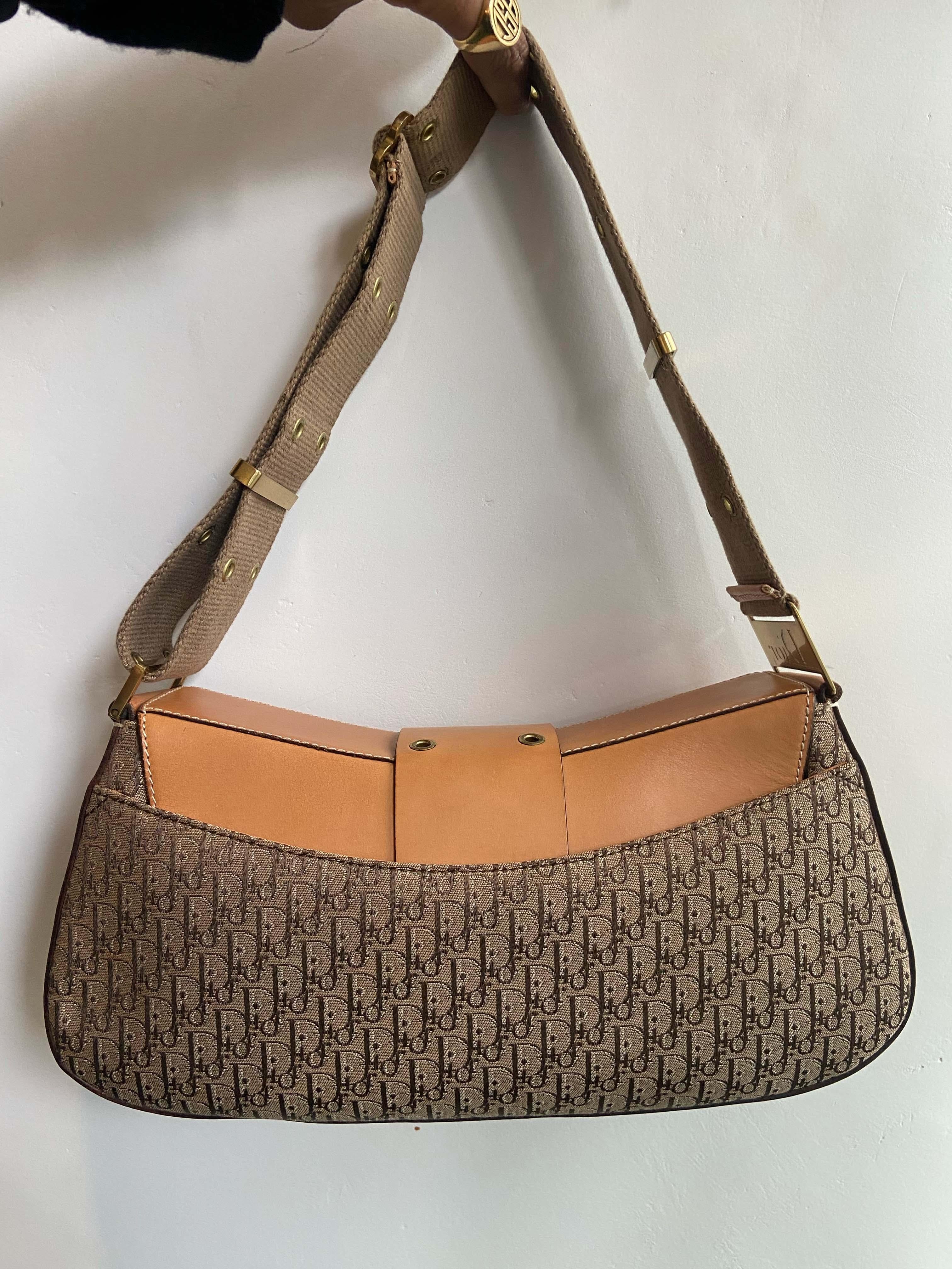 Christian Dior by John Galliano 2003 Columbus monogram handbag. Features Dior hardware, structured shape, canvas body, cowhide leather features, inside zip back pocket and adjustable shoulder strap. In good vintage condition.

Brand: Christian