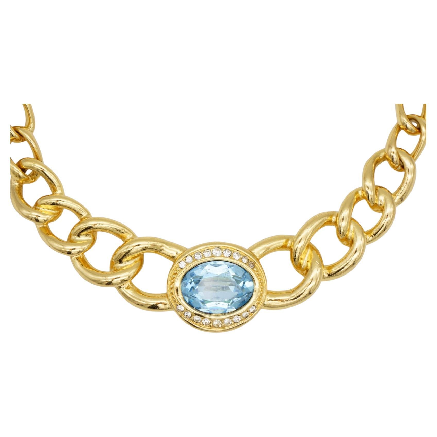 Christian Dior Vintage 1980s Aqua Blue Oval Crystals Interlocked Chunky Link Collar Choker Necklace, Gold Tone

Very good condition. Marked 'Chr. Dior (C) '. 100% Genuine.

Length: 45 cm. Extend chain: 2 cm. Pendant: 10.2*2.2 cm.

Weight: 83 g.

_ _