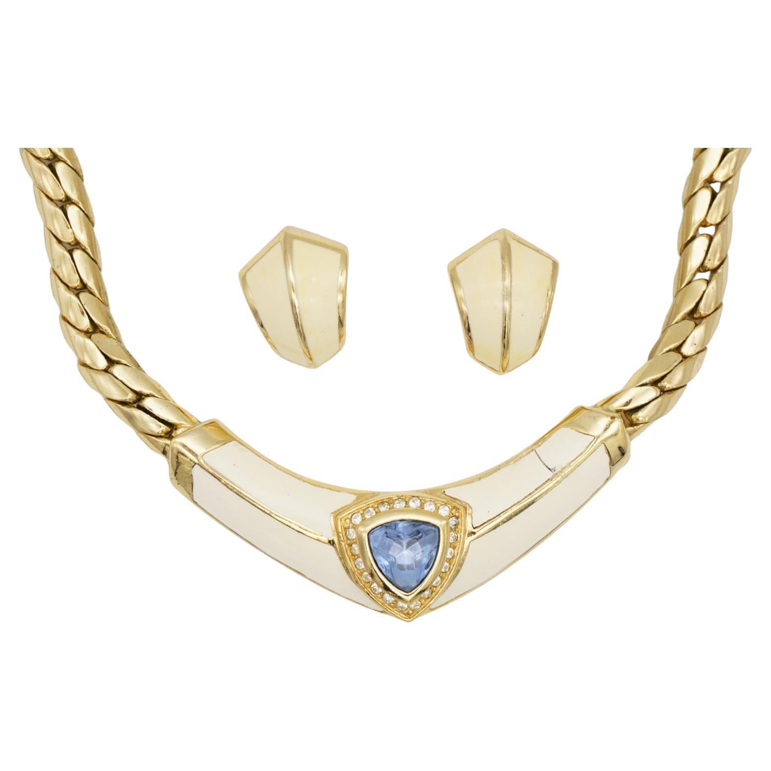 Christian Dior Vintage 1980s Aqua Blue Triangle Crystals Beige Chunky Jewellery Set Necklace Dome Pierced Earrings, Gold Tone

Very good condition. The pendant has a small split on one side of cream enamel, barely noticeable when wear it. 

Marked