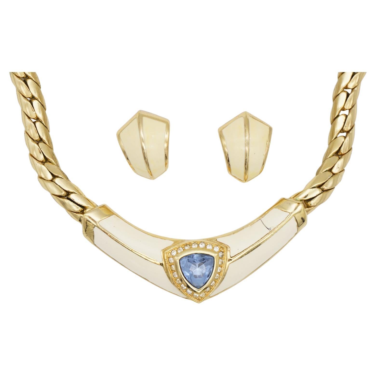 Christian Dior Vintage 1980s Aqua Blue Triangle Crystals Beige Chunky Jewellery Set Necklace Dome Pierced Earrings, Gold Tone

Very good condition. The pendant has a small split on one side of cream enamel, barely noticeable when wear it. 

Marked