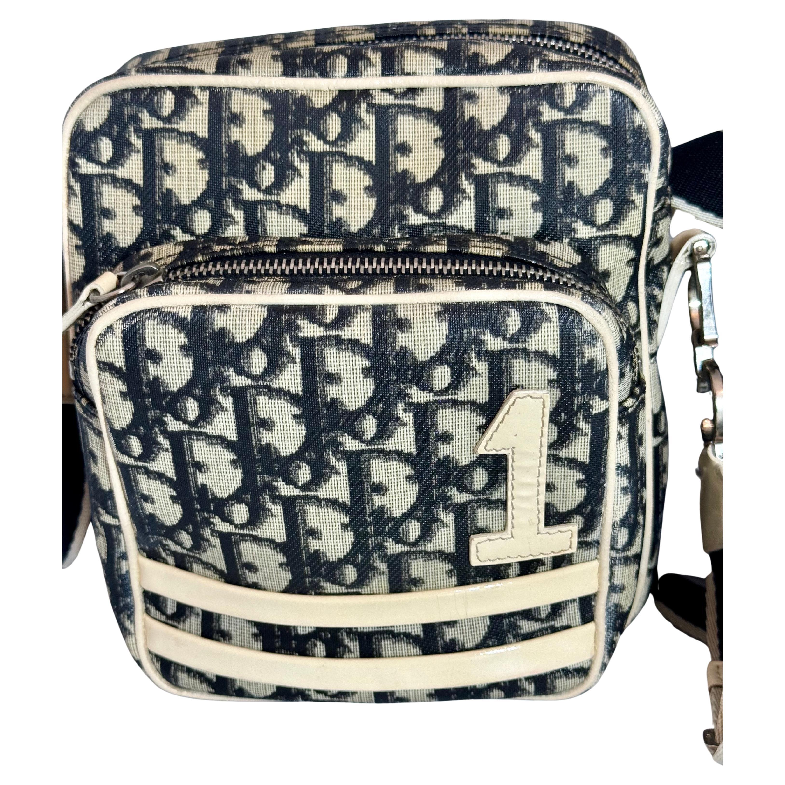 This authentic Christian Dior 
CHRISTIAN DIOR
VINTAGE - EXCELLENT CONDITION!
Very Rare to Find this Bag in this Condition!
100% Guaranteed Authentic!
Black beige Dior monogram canvas and black satchel with Silver hardware.
Bag measures approx. 7.5H