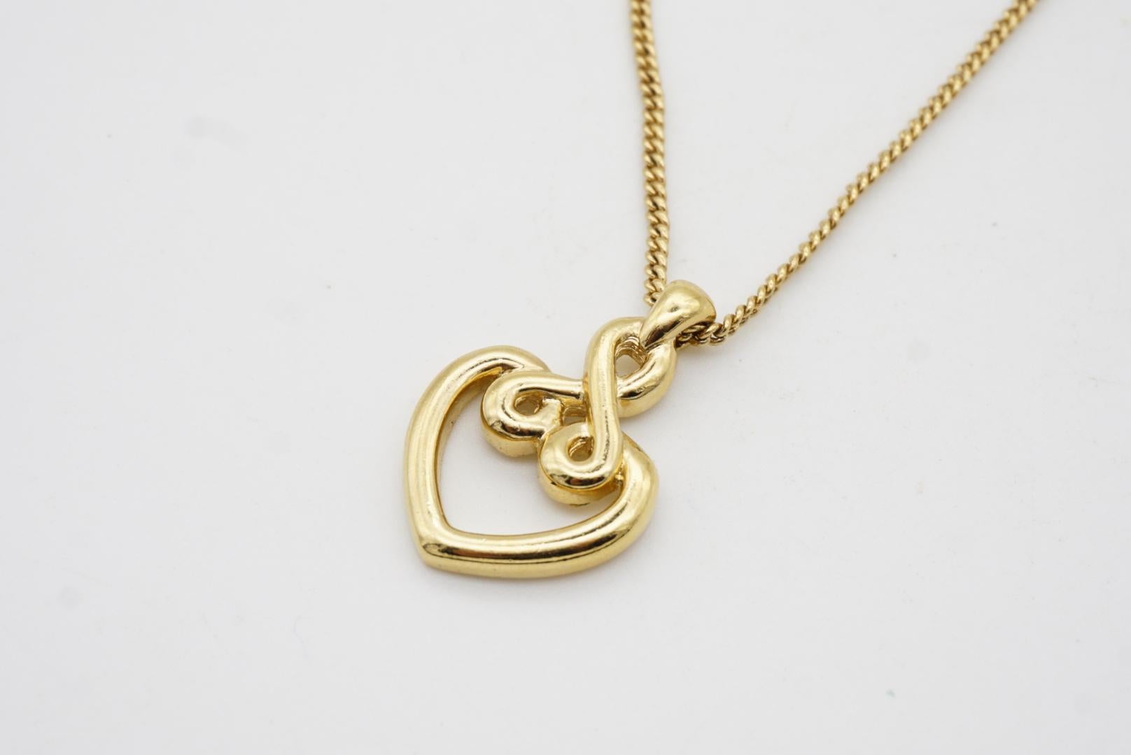 Christian Dior Collana barocca d'epoca con ciondolo in oro con cuore e nodo d'amore traforato in vendita 5