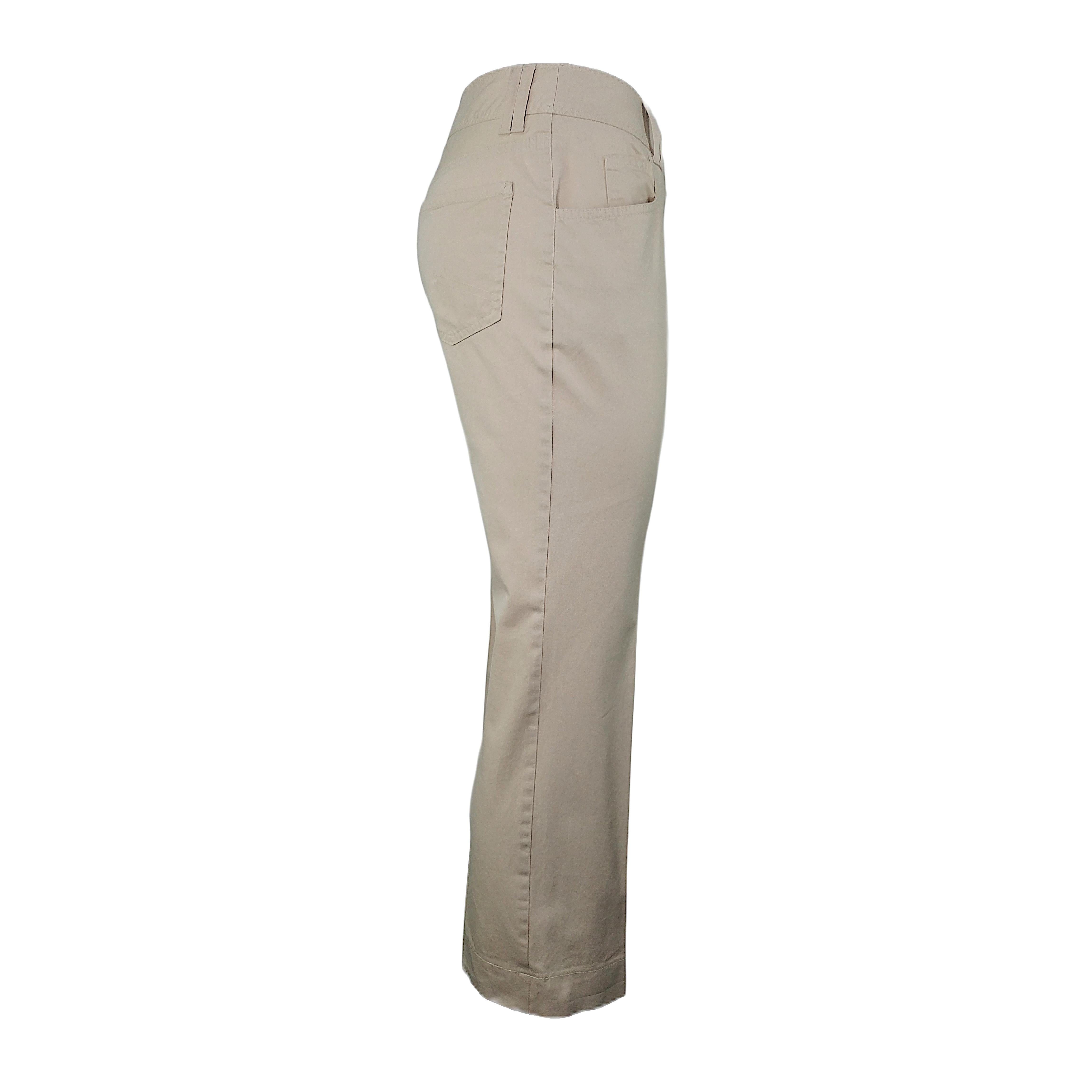 A pair of vintage beige Dior pants with a 5-pockets design, a mid-low rise, closure with snap button and hook, and 7/8 calf length. Although the label is discolored, you can clearly feel this is cotton fabric. The pants are in good vintage