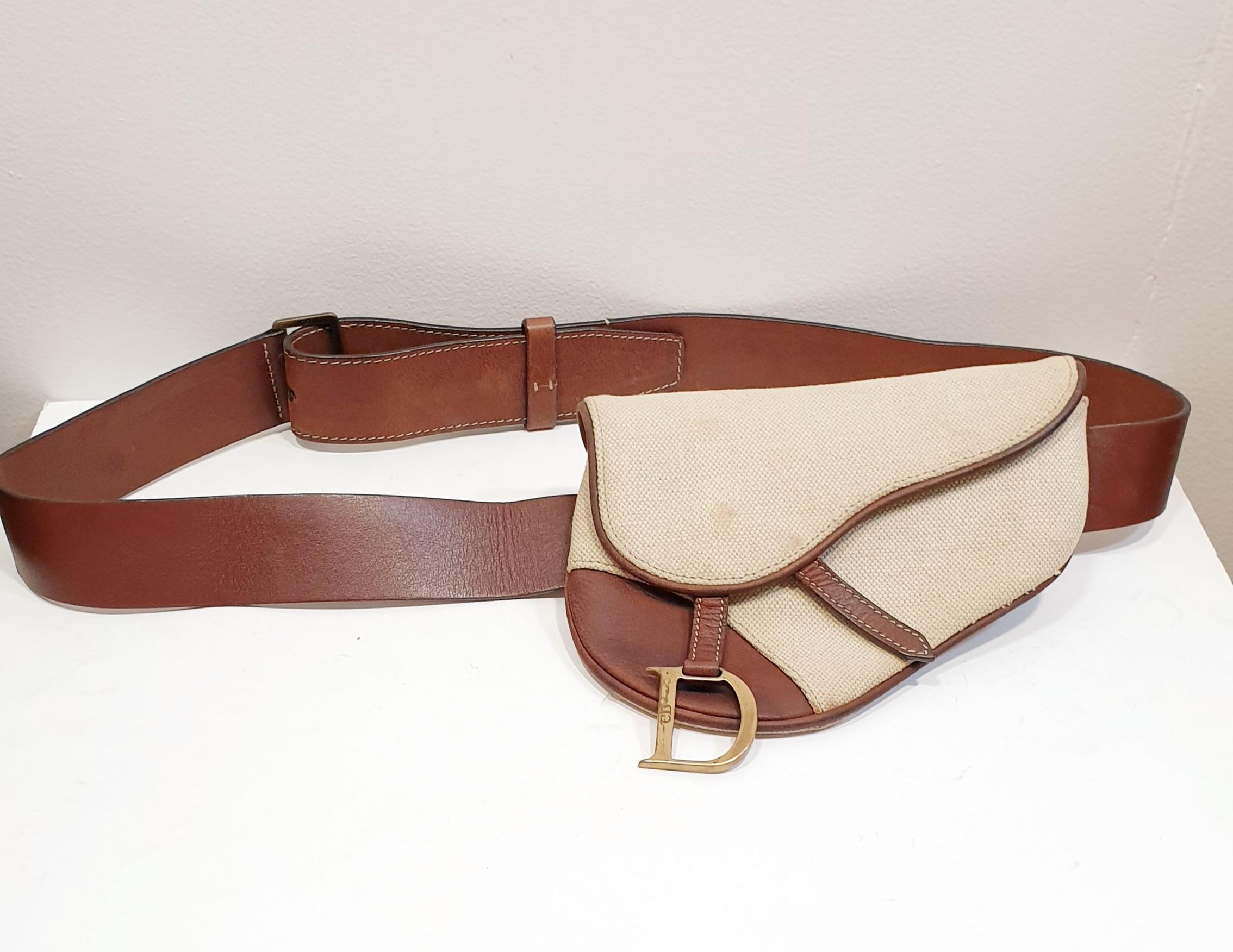 Dior Waist Christian Saddle Fanny Pack Vintage Rare Off White Leather Cross Body Bag

Crafted from canvas and leather, this ivory and brown saddle waist belt bag from Christian Dior features a foldover saddle flap with magnetic closure, a hanging