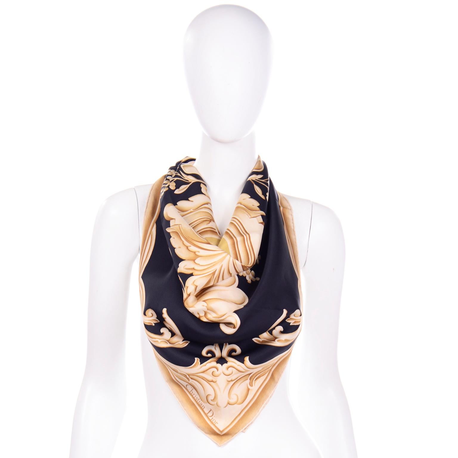 This vintage baroque Christian Dior black scarf has a gold flourish and botanical print and the detailed shading gives the print great dimension. The hem of this beautiful scarf has been hand rolled and it is made of 100% silk. 
33