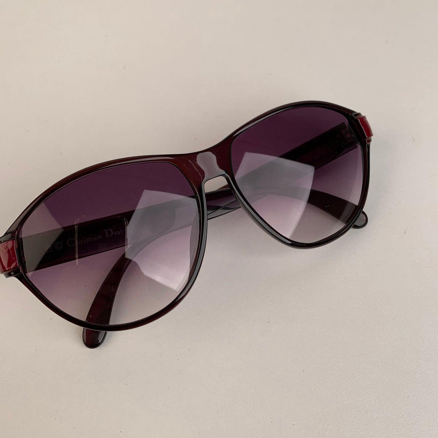 CHRISTIAN DIOR Vintage 1970s black and burgundy sunglasses. Gradient purple new lenses. Optyl frame, handmade in Germany. CD logo on temples. Mod. & Refs: 2325 - 80 - 57/12 Details MATERIAL: Plastic COLOR: Black MODEL: 2325 GENDER: Women COUNTRY OF