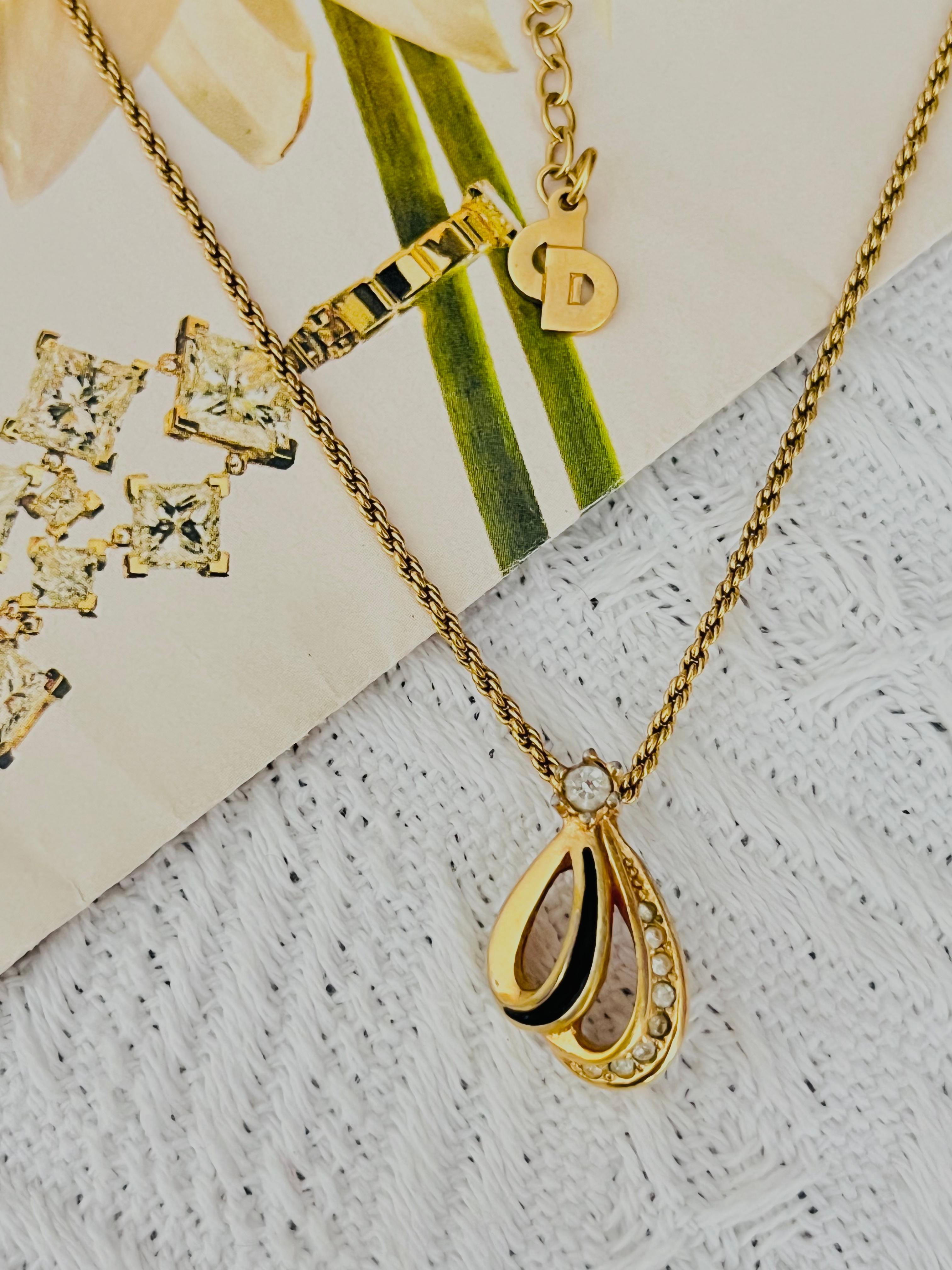 Christian Dior Vintage 1980s Unisex Black Enamel Crystals Shell Petal Water Drop Modernist Pendant Necklace, Gold Tone

Good condition. Light scratches and colour loss, but not any stones lost, still good to wear. 100% genuine. 

Renowned for its